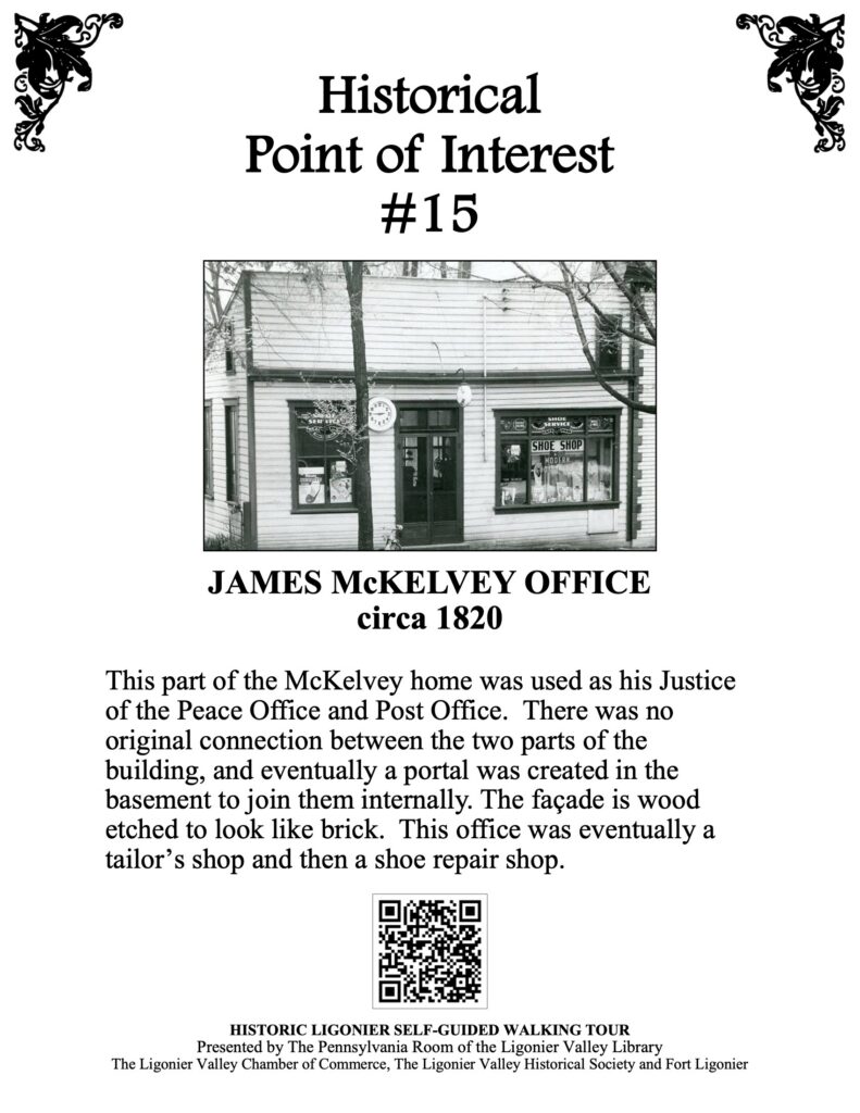 This part of the McKelvey home was used as his Justice of the Peace Office and Post Office. There was no original connection between the two parts of the building, and eventually a portal was created in the basement to join them internally. The façade is wood etched to look like brick. This office was eventually a tailor’s shop and then a shoe repair shop.