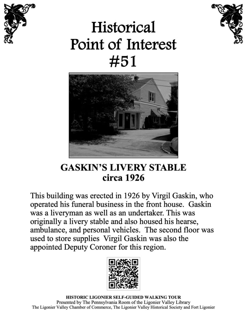 This building was erected in 1926 by Virgil Gaskin, who operated his funeral business in the front house. Gaskin was a liveryman as well as an undertaker. This was originally a livery stable and also housed his hearse, ambulance, and personal vehicles. The second floor was used to store supplies Virgil Gaskin was also the appointed Deputy Coroner for this region.